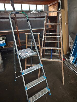 a ladder that is leaning against a wall in a room