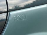 a close up of a car ' s emblem on the side of the car