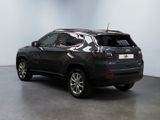the back of a black jeep compass parked in a room