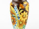 a vase with a floral design on it on a white background