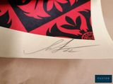 signed photograph of a red and black tie with a black and red design