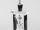 an image of a glass table lamp with a black base and a silver base