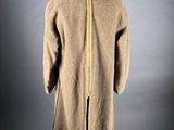 a brown coat with a zipper on the back and a yellow zipper on the front