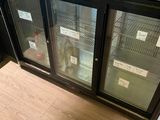 a counter with two glass doors on it in a store