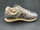 the new balance shoes are grey and tan with a white sole