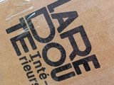 a brown box with a logo on it sitting on a table