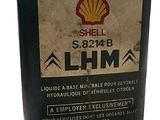 an old shell oil can is sitting on a white surface