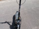 a scooter that is parked in the parking lot