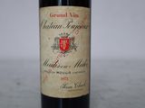 a bottle of wine that is sitting on a table