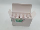 a box of pills sitting on a white surface