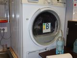 a washer and a dryer in a small room