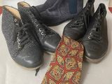 four pairs of shoes, a tie, and a pair of boots