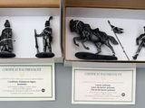 two boxes with figurines of different types in them