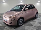 an image of a pink smart car in a showroom
