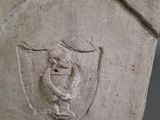 a stone sculpture with a bird on it ' s head