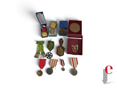 a small collection of medals and medals on a table