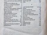 an old book with a list of numbers on it sitting on top of a table