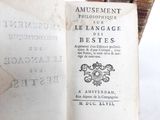 an old book with writing on it sitting on a table