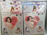 two packages of stickers with a girl ' s picture on them