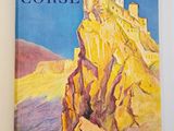 an open book with a picture of a castle on top of a mountain
