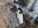 a piece of machinery that is laying on the ground