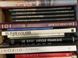 a lot of books in a box on the table