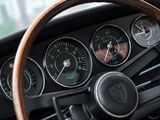 a steering wheel and dashboard of a car with many gauges