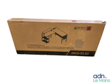 a cardboard box with a computer desk inside of it