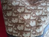 a close up of a purse on a red surface