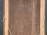 an old wooden easel with a painting on top of it