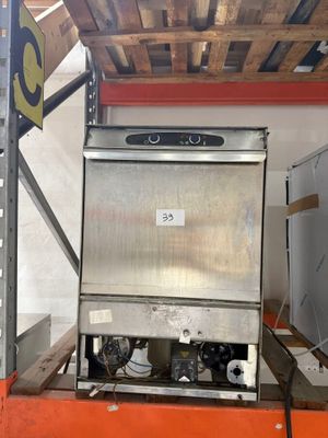 a machine that is sitting on a pallet in a warehouse