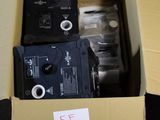 boxes containing two different types of electronic devices are sitting on a table