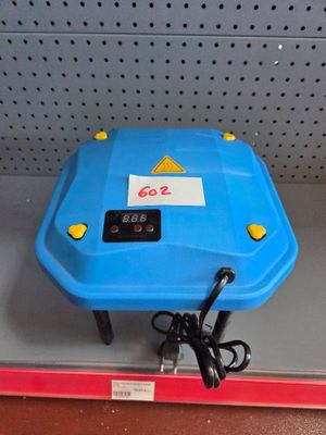 a blue plastic table with a clock on it