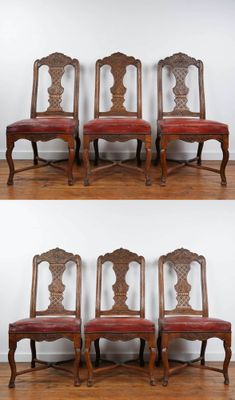 six chairs with red upholstered leather seats on a wooden floor