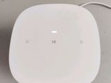 a white plate sitting on a table with a cord attached to it