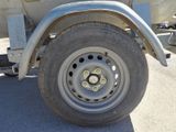 a close up of a flat tire on a truck