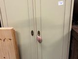 a cabinet that is sitting in the middle of a room