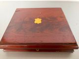 a wooden box with a yellow apple logo on it