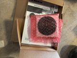 a cardboard box with a cookie in it on the floor