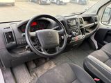 a dashboard of a truck with a steering wheel and dashboard controls