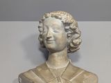 a statue of a woman that is sitting on a table