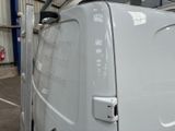 a white van that is parked in a garage