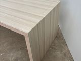 a picture of a wooden table in a room