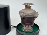 a lamp that is sitting on a table next to a box