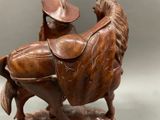 a statue of a horse with a saddle on it