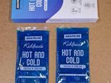 two packs of hot and cold condoms sitting next to each other on a table