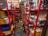 a room with a lot of shelves filled with supplies