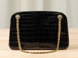 black croc embossed clutch bag with gold chain strap
