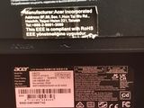 the back of a black laptop with a label on it