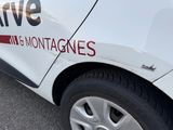 a white car with a red stripe on the side of it